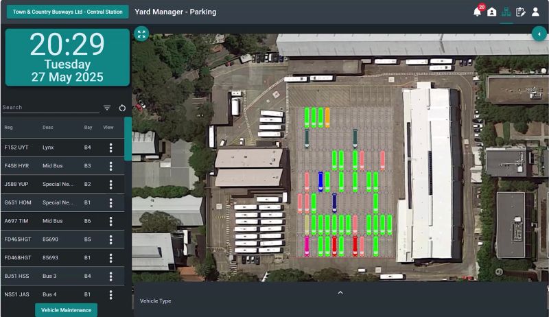 Software showing an aerial view of a parking lot with buses color-coded in bright green, red, and blue.